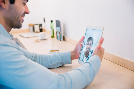 Man having a telehealth consultation from home