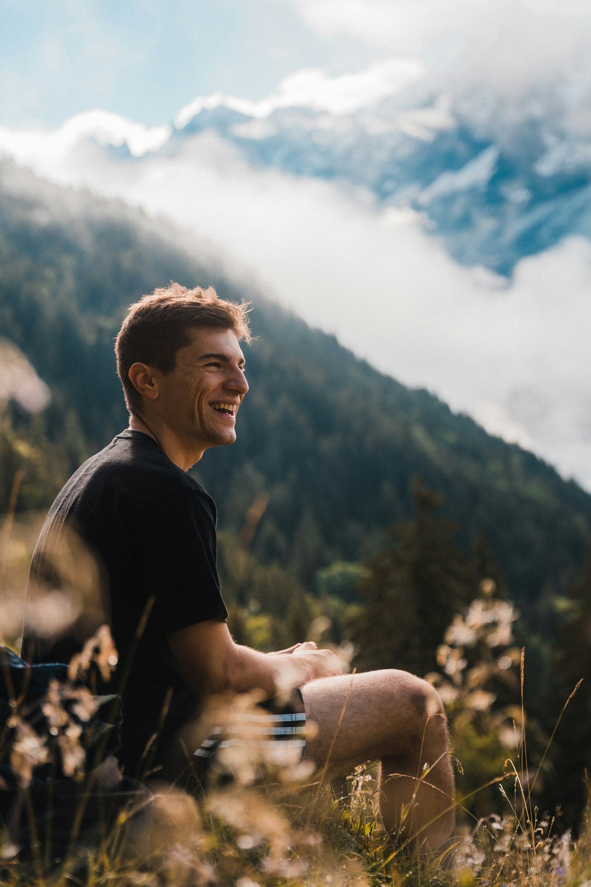 What causes male hair loss, man smiling after using effective hair loss treatment